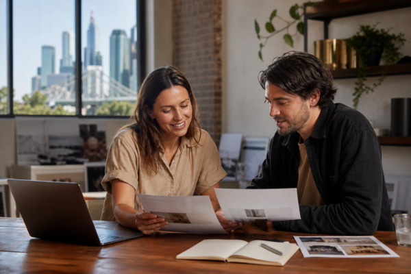 Brisbane small-business owner comparing website design quotes with a web designer