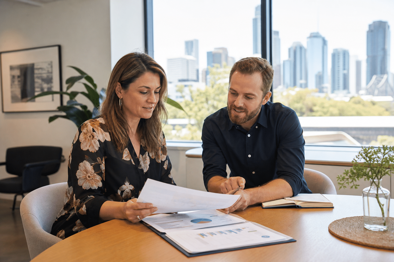 Brisbane business owner comparing SEO agency proposals with a digital marketing consultant