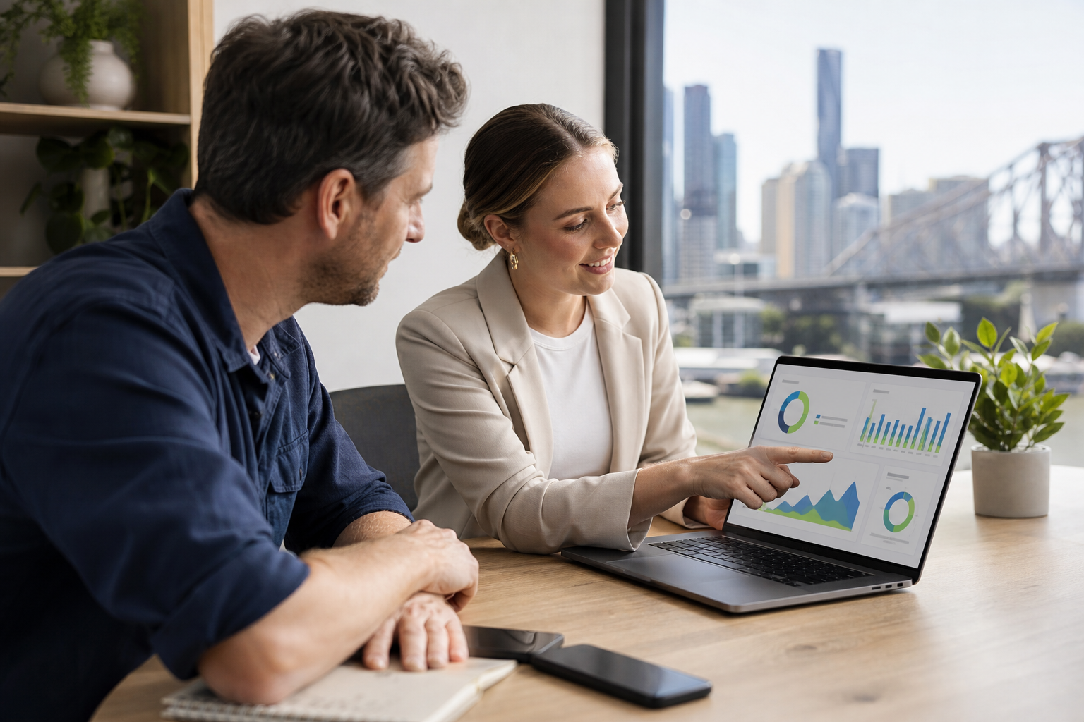 Brisbane small business owner reviewing a local SEO audit with a digital marketing consultant