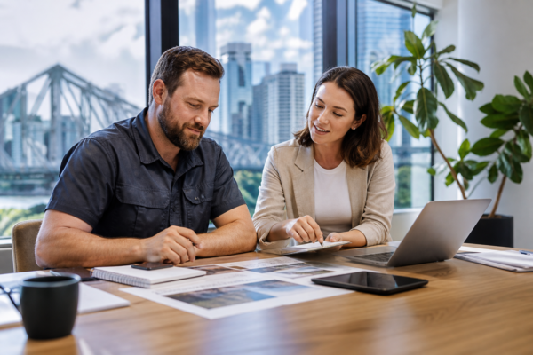 Brisbane service business owner discussing local SEO and qualified phone enquiries with a digital marketing consultant