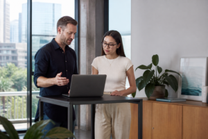 Brisbane business owner reviewing a website redesign plan with a web designer